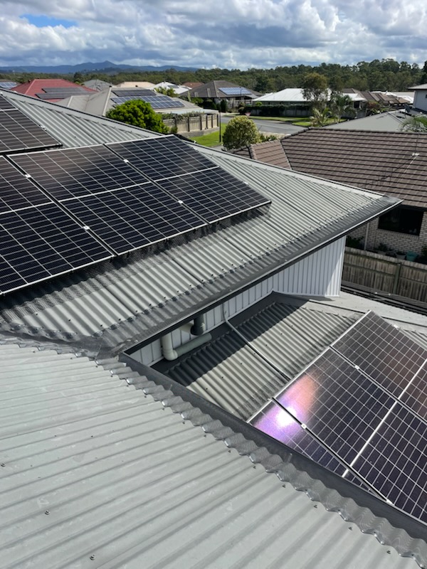 Solar panels on SEQ home with birdproofing mesh installed by External Powerwash Solutions
