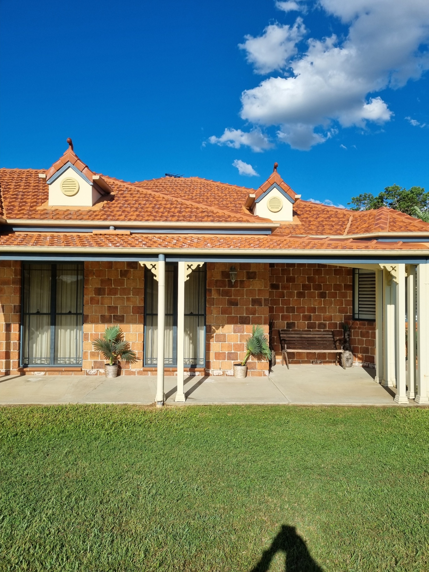 Clean terracotta roof tiles after professional soft wash treatment by External Powerwash Solutions SEQ