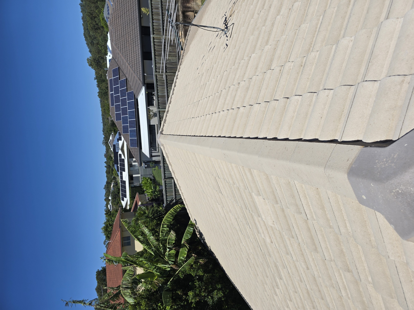 Concrete tile roof restored to original colour after professional soft wash by External Powerwash Solutions in South East Queensland