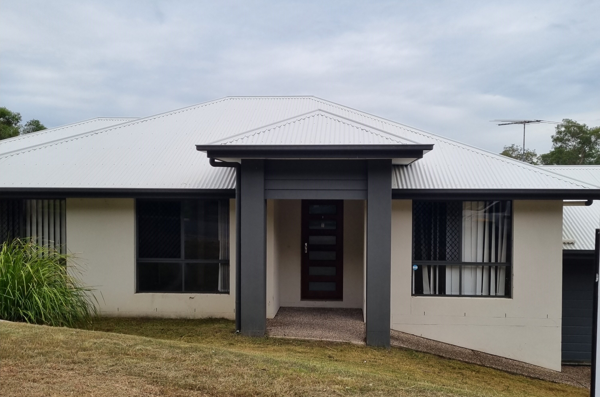 Same South East Queensland home after professional pre-sale exterior and roof clean — transformed street appeal